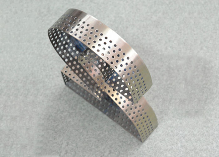 Perforated glowing letter logo in stainless steel