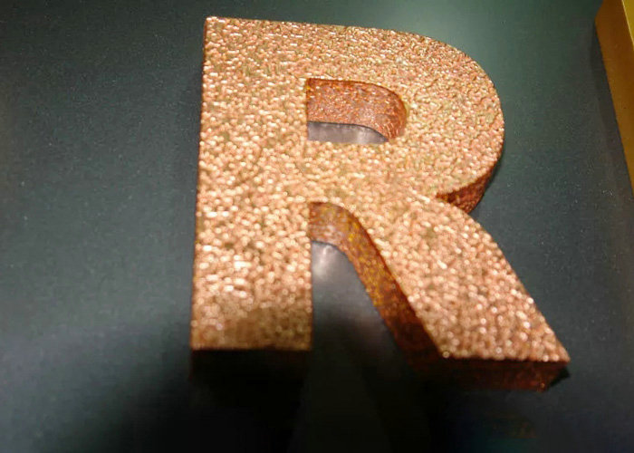 Metallic painting the letter with gold foil finish