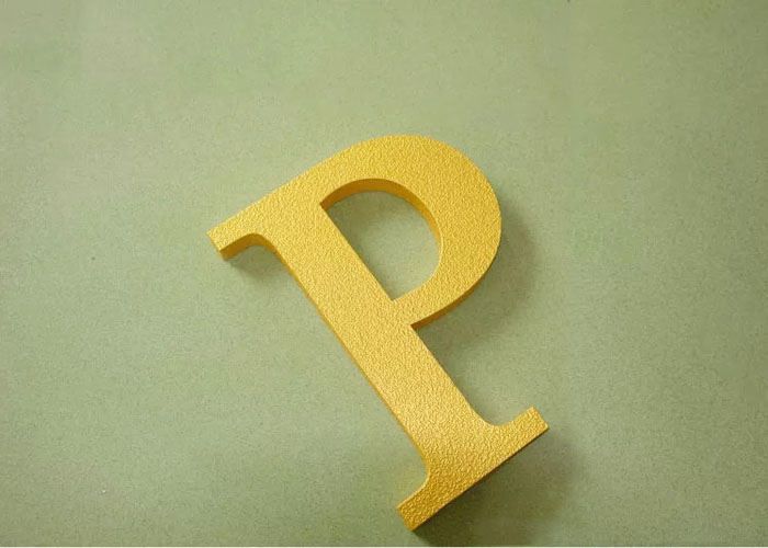Welding the letter with gold foil finish