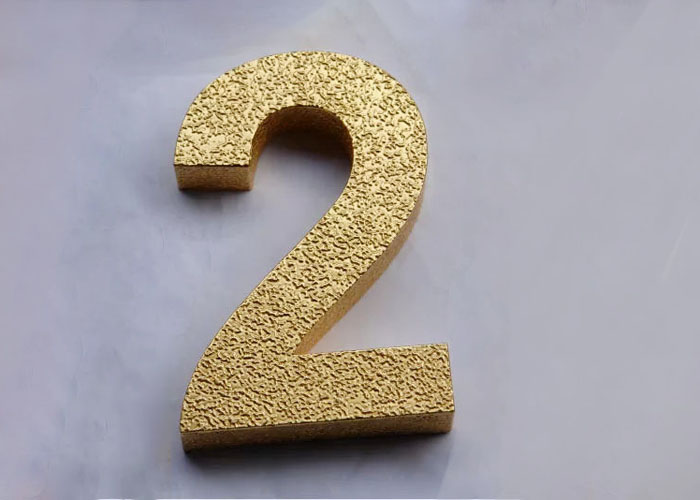 Laser cutting the letter with gold foil finish