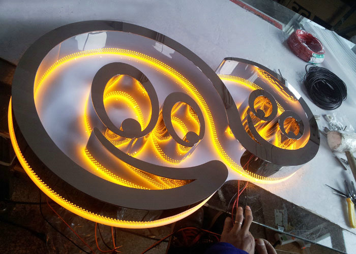 Welded and polished side-illuminated perforated glowing letters
