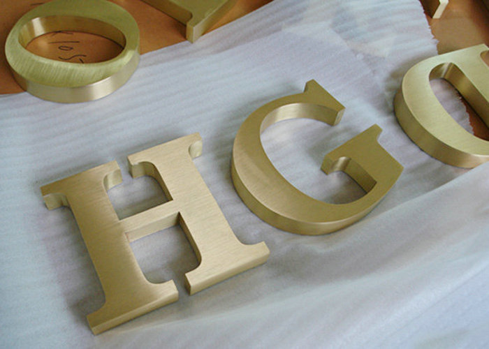 Welding laser cut brass letter logo